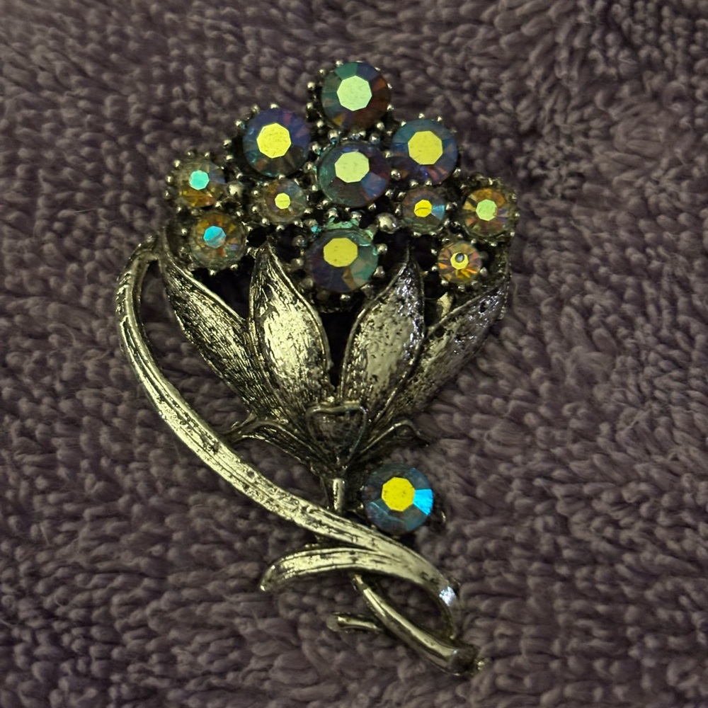 Floral Brooch with blue Iridescent Stones